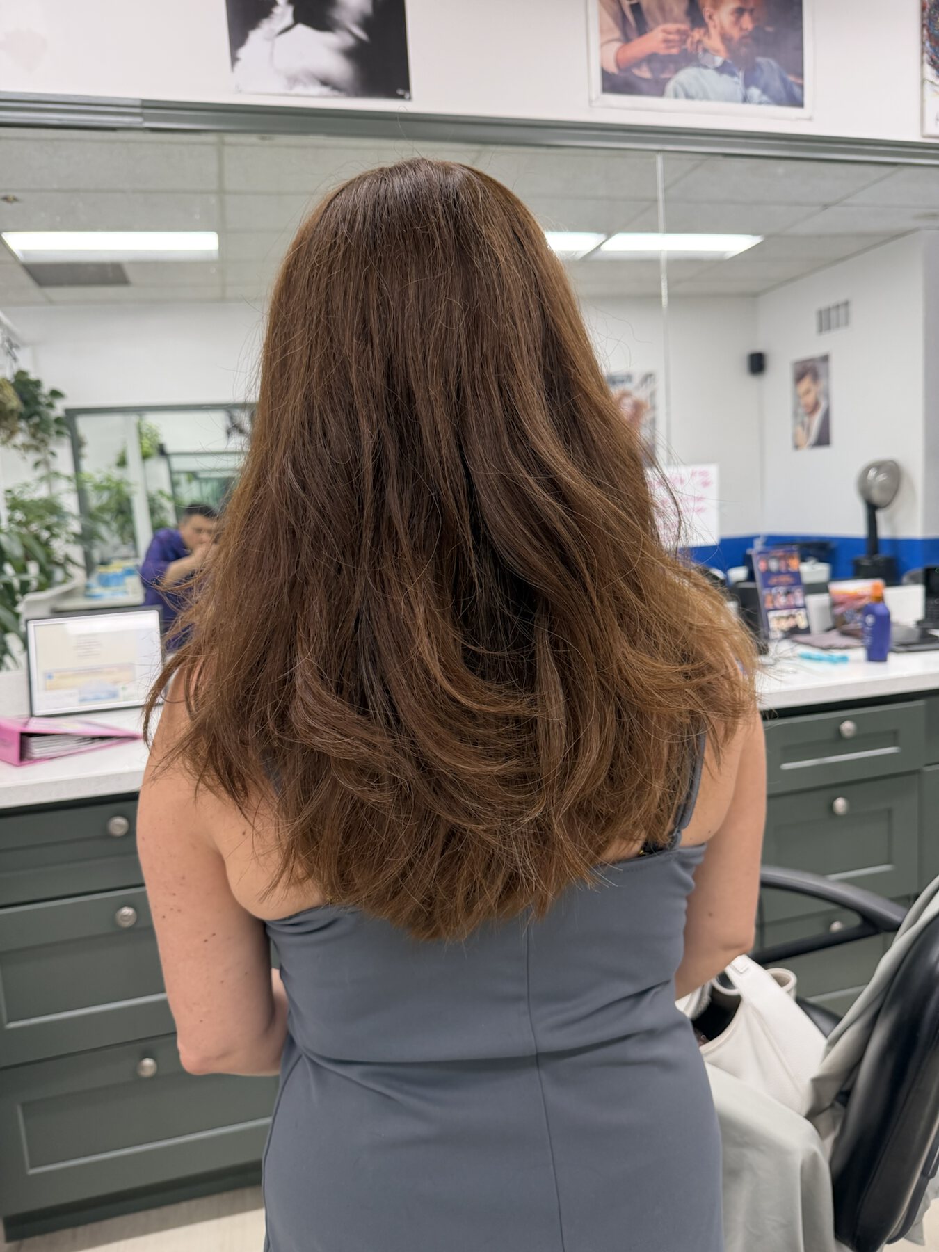 Fresh long layered haircut styled at Dimension Hair Salon in Bothell, Washington